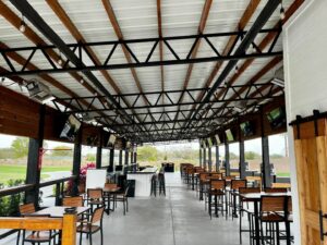 Spacious seating and dining area in the custom commercial pole barn at Southern Dunes Golf and Country Club.
